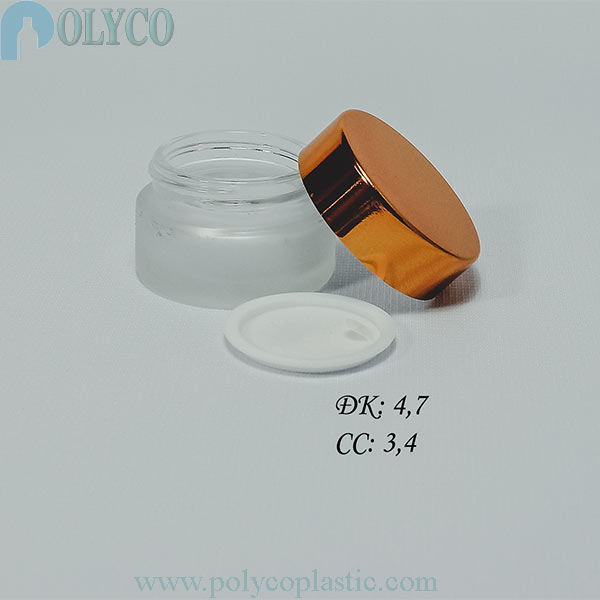 Glass jar containing beautiful cosmetics, many different sizes