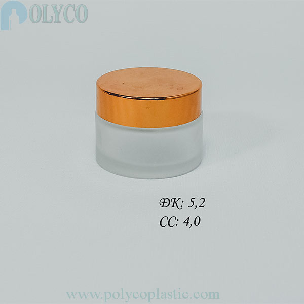 Round glass jar containing beautiful cosmetics, many different sizes