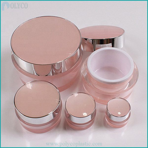 Pink cosmetic jars of different sizes