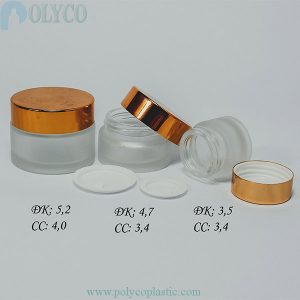Round cosmetic glass jar with gold lid